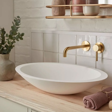 Lifestyle image of Vado Individual Knurled Accents Brushed Gold Wall-Mounted Basin Mixer